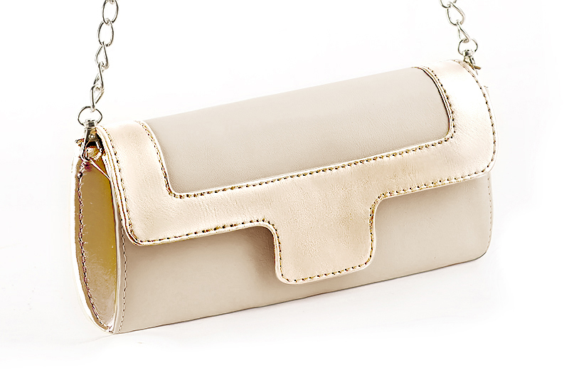 Handcrafted women's elegant clutch in premium champagne white and gold leather. Perfect for weddings, ceremonies, and parties.  
                Choose from our luxurious collections of leather and fabric to perfectly match your clutches to your outfits.